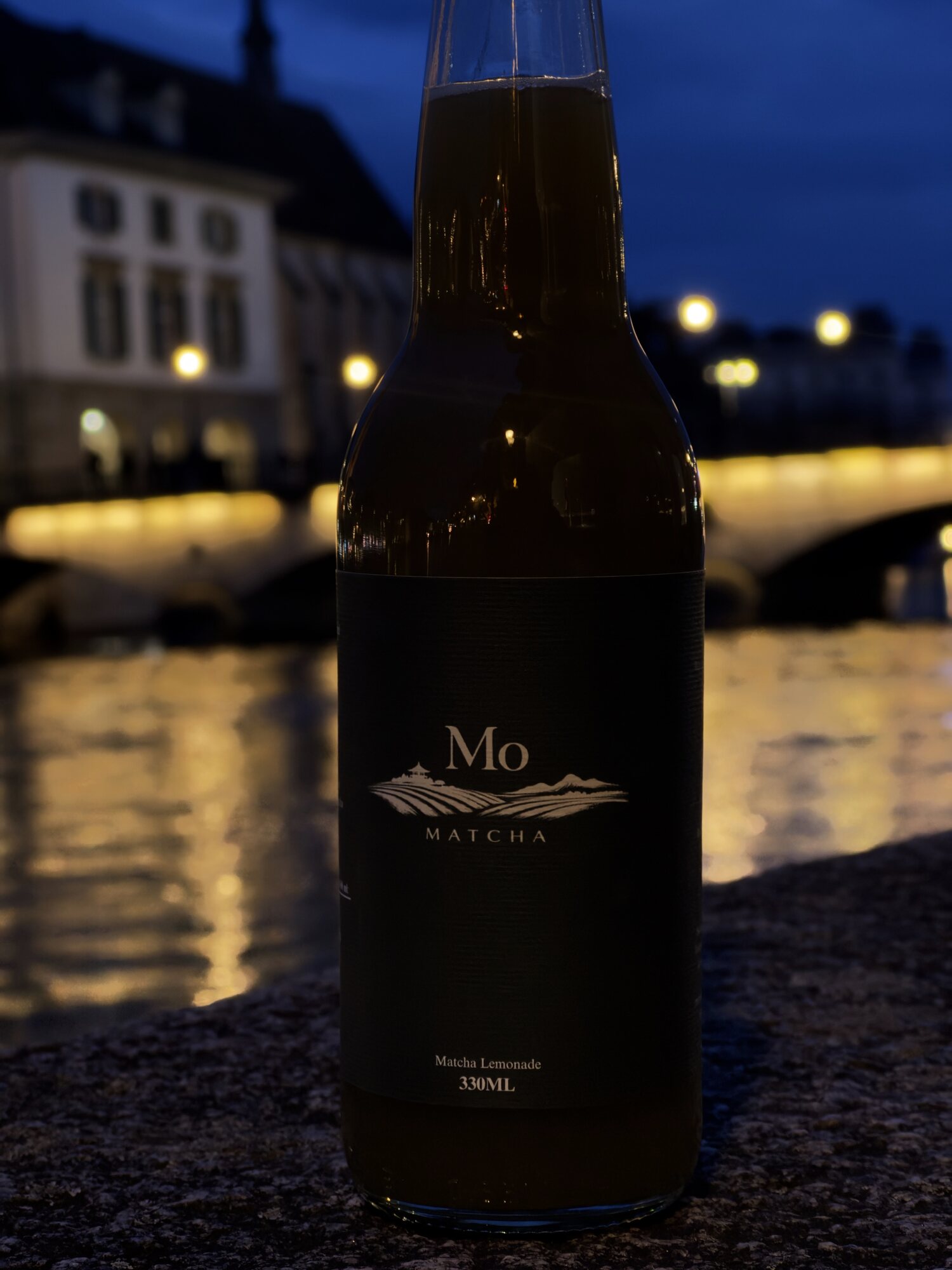 Mo Matcha lemonade by the Zürich river at blue hour